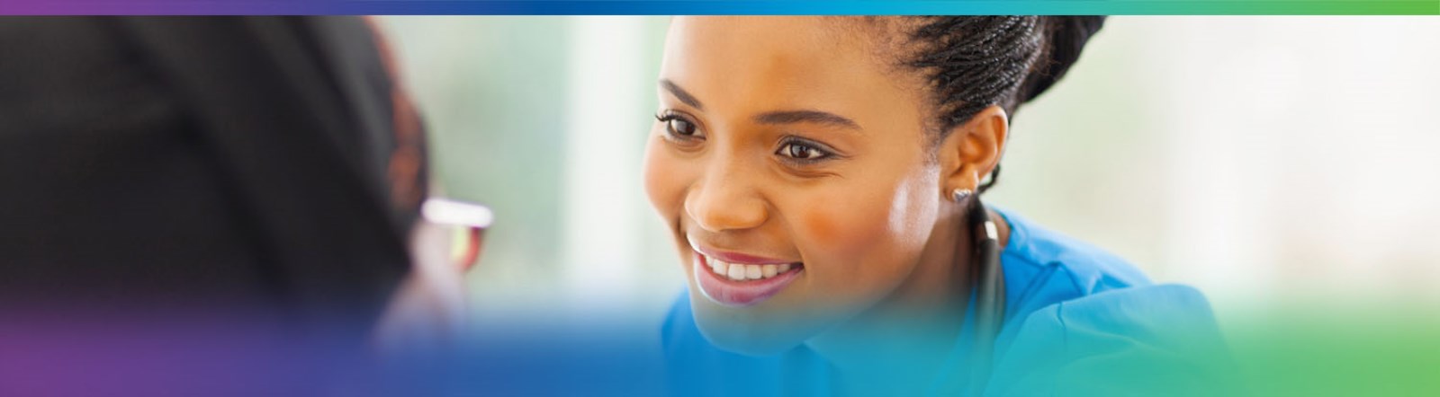 Nursing student smiling at patient